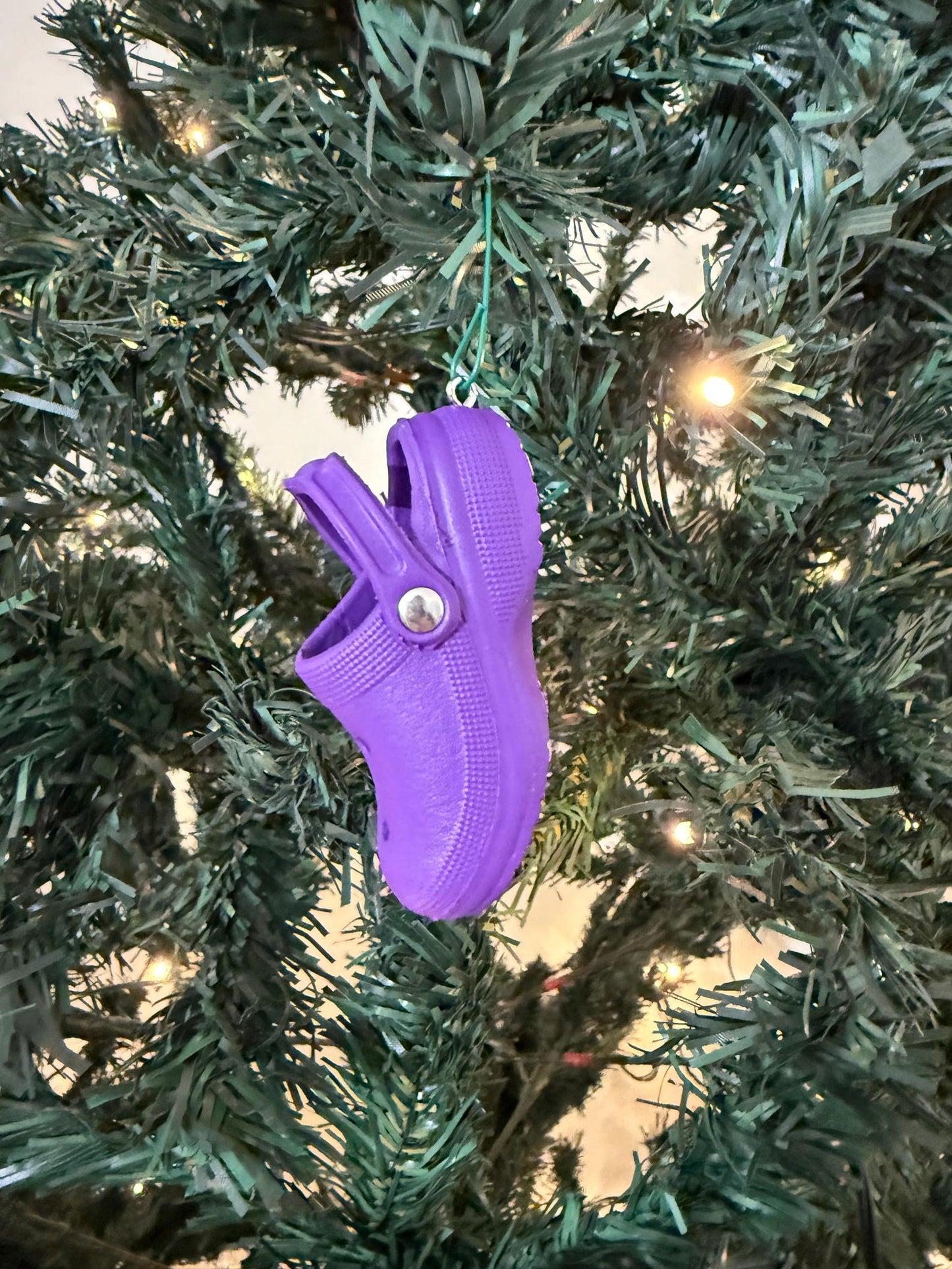 Mini colorful Croc Christmas ornament hanging on tree
