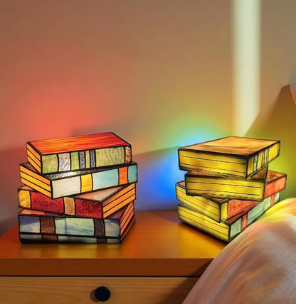 stained glass book lamp set glowing on nightstand for book lovers