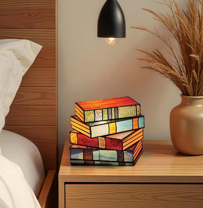 stained glass book lamp set glowing on nightstand for book lovers